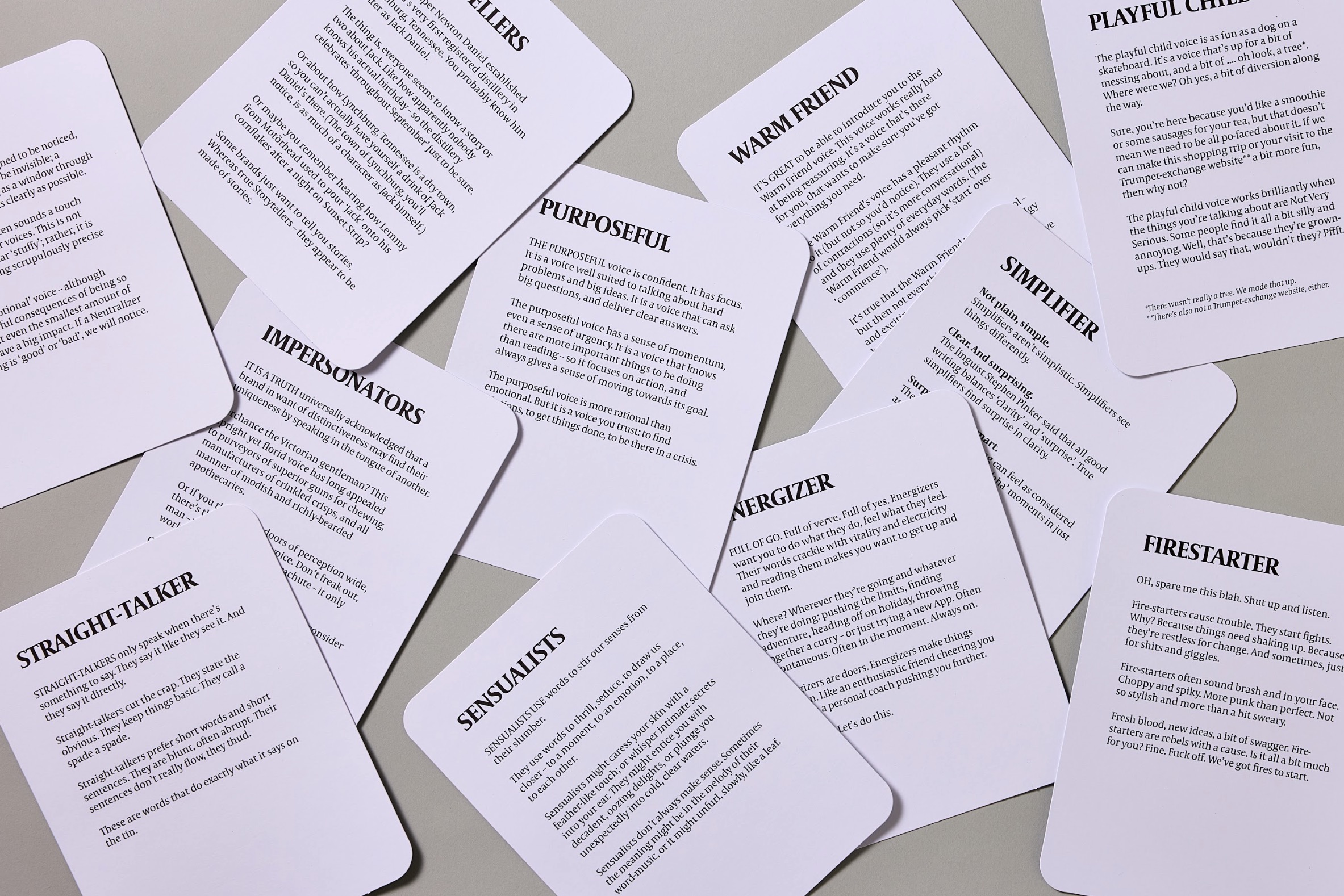 The 11 primary voice cards scattered on a surface.