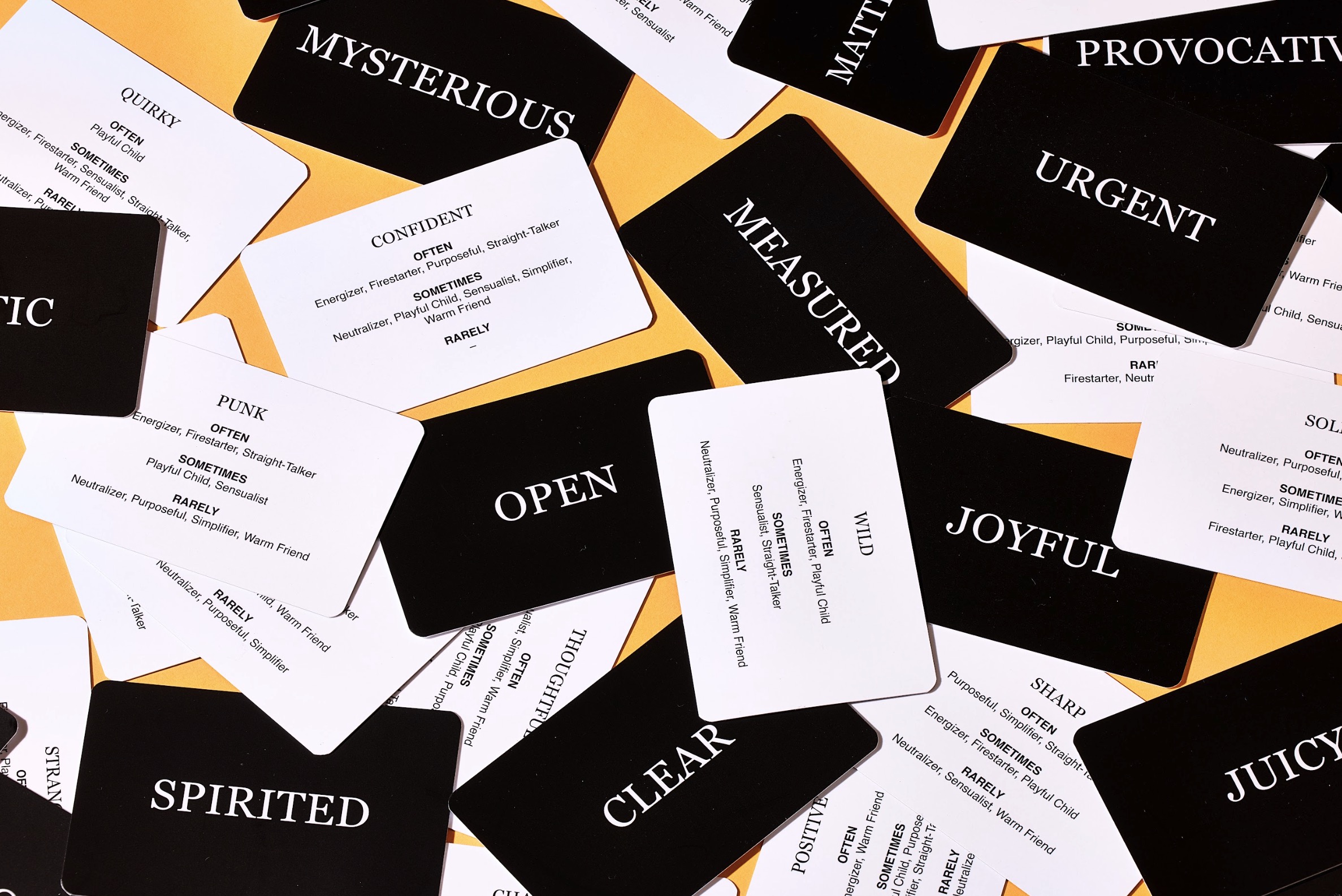 The tarot cards mixed up with some face up to show their descriptive word, and others showing the details about the voice.