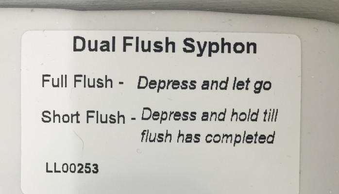 Sticker labelled “Dual Flush Syphon” with the following instructions: Full Flush – depress and let go, Short Flush – Depress and hold till flush has completed.